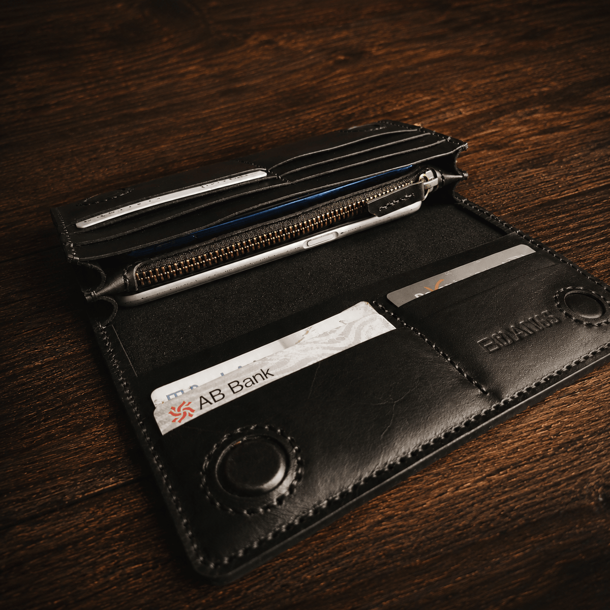 Open handmade black leather long wallet with multiple card slots